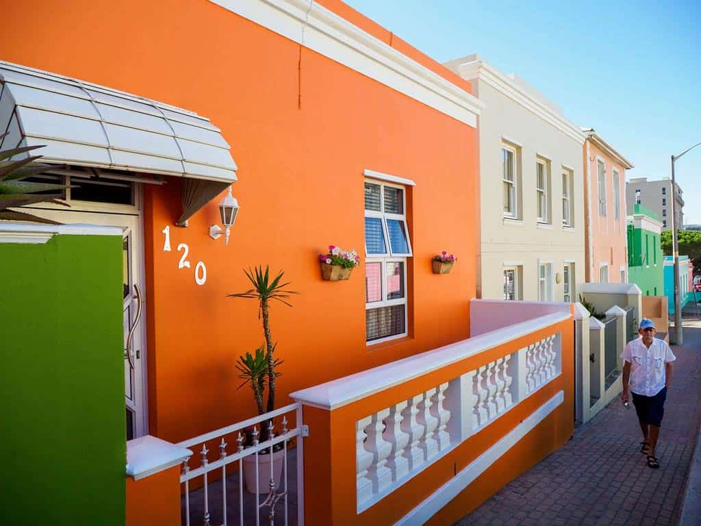 Man Walking Colourful Street