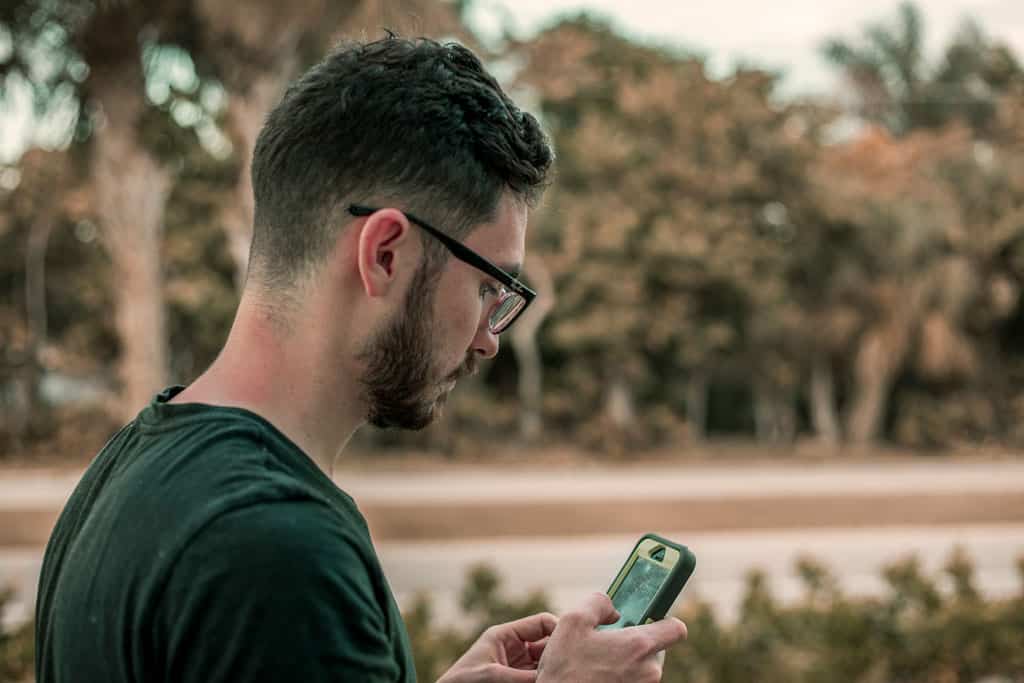 Man Using A Cell Phone Outside