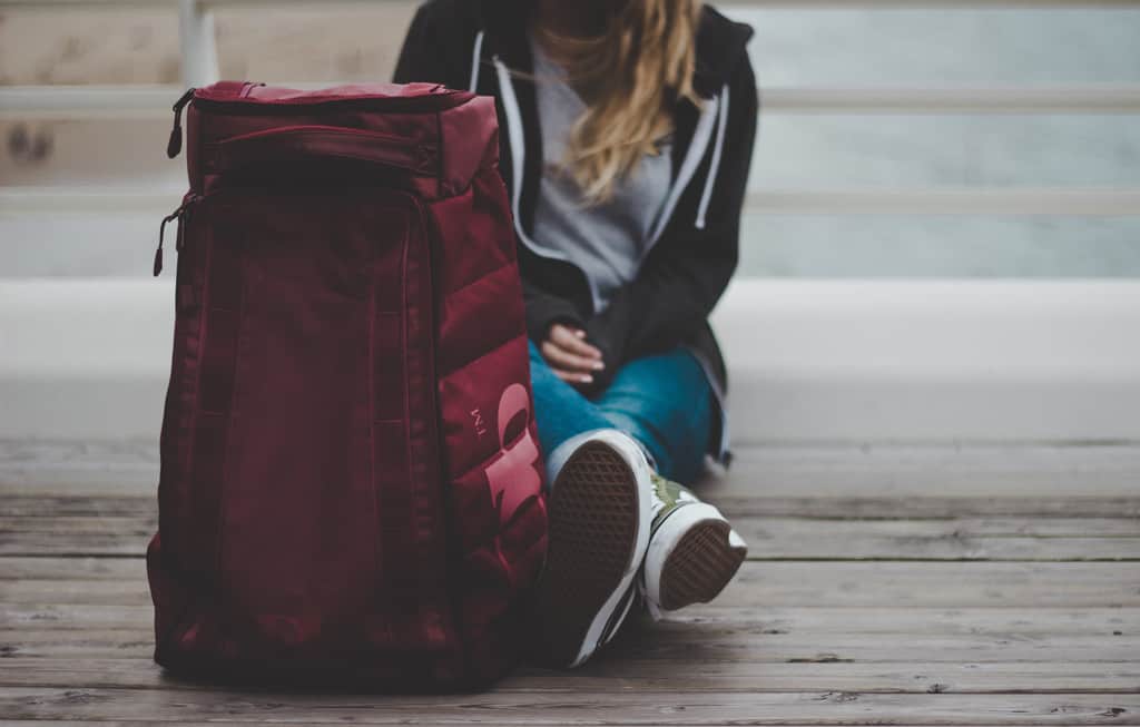 Person Sitting Near Luggage