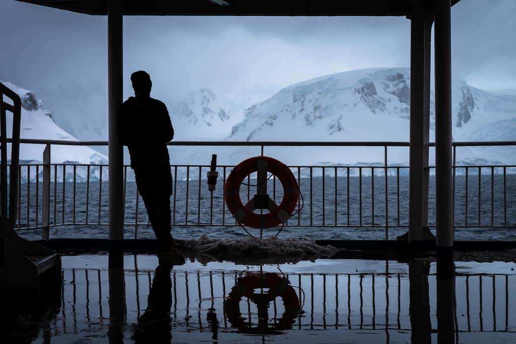Person Standing On A Ship.